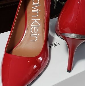 Red Calvin Klein pumps